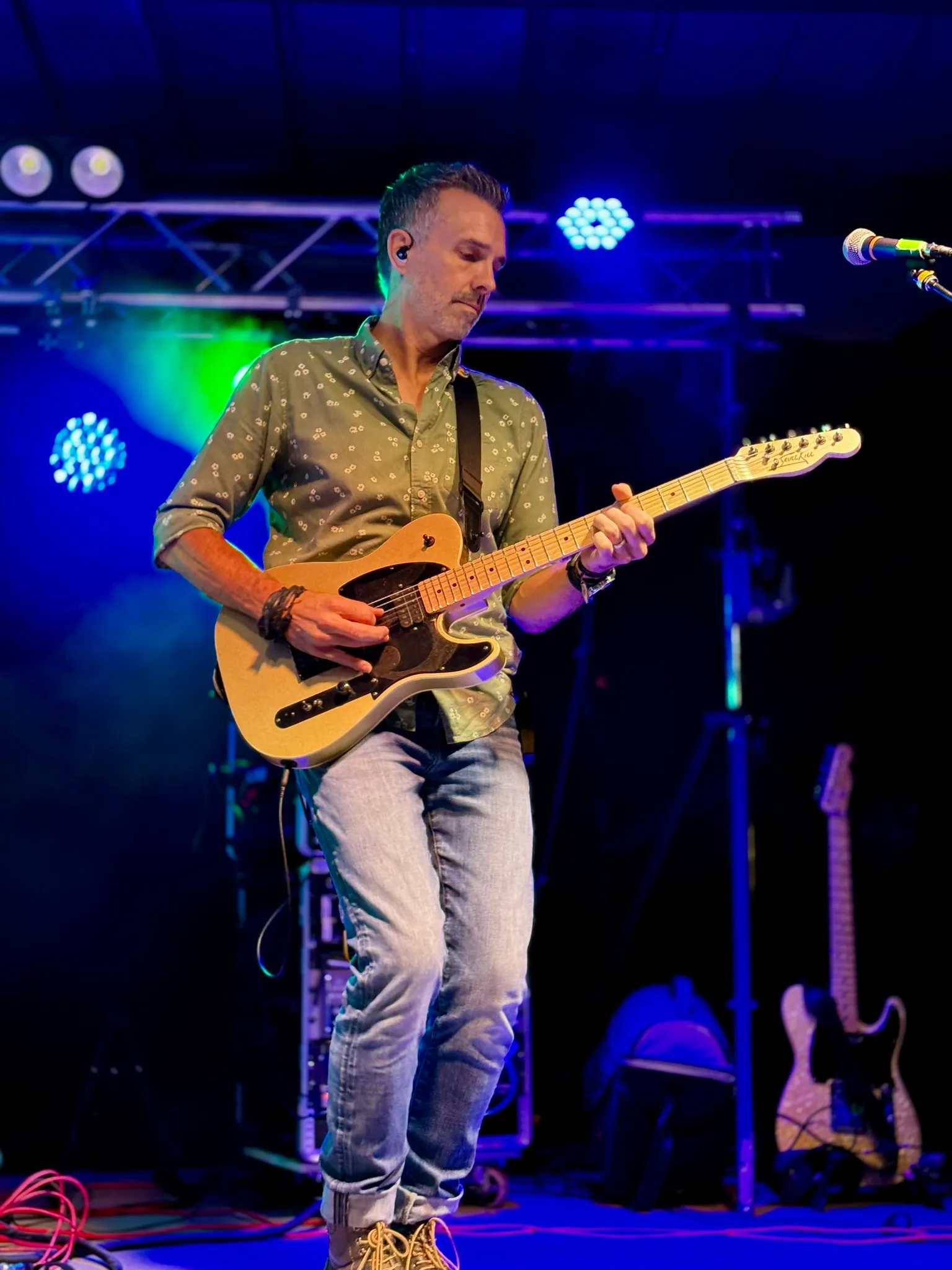 Scott Hill, founder of EZBand Flow, performing on stage